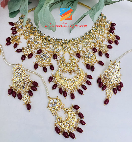 Maroon Ruby Golden Kundan Pendant Necklace Earrings Tikka Set